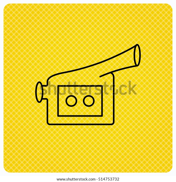 Video camera icon. Retro cinema sign. Linear icon\
on orange background.\
Vector