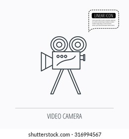 Video camera with reel icon. Retro cinema sign. Linear outline icon. Speech bubble of dotted line. Vector