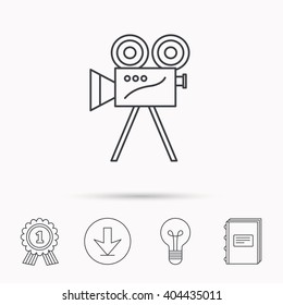 Video camera with reel icon. Retro cinema sign. Download arrow, lamp, learn book and award medal icons.