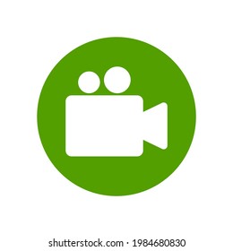 Video camera round icon. White silhouette in green circle. Isolated vector symbol. 
