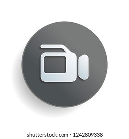 Video camera with screen. White paper symbol on gray round button or badge with shadow