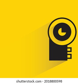 video camera with shadow on yellow background