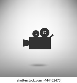 Video camera sign. Dark gray icon with shadow on floor.