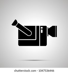 Video camera silhouette, simple black icon with shadow