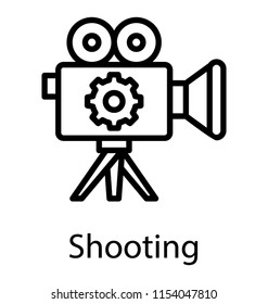 
A video camera with thee gear depicting shooting 
