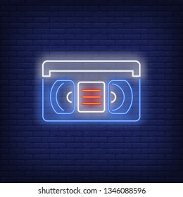 Video cassette neon sign. Glowing neon film cassete on brick wall background. Vector illustration can be used for cinema, entertainment, video