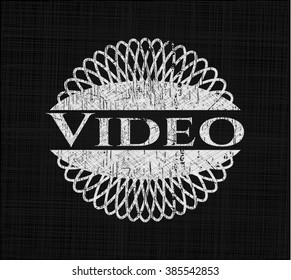 Video chalkboard emblem on black board