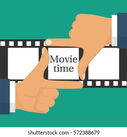 Video filming concept. Movie time isolated. Coming soon template. Gesture male hand frame on the filmstrip background. Vector illustration flat design. 