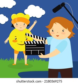 Video footage of girl in sun costume and clapperboard boy