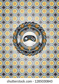 video game icon inside arabesque emblem. arabic decoration.