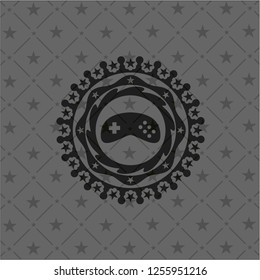 video game icon inside black emblem