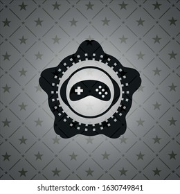 video game icon inside black emblem