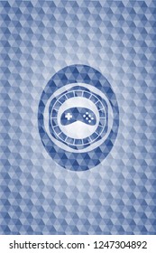 video game icon inside blue emblem with geometric background.