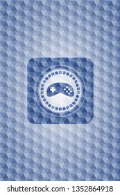 video game icon inside blue emblem with geometric background.