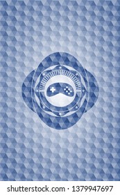 video game icon inside blue emblem with geometric pattern background.
