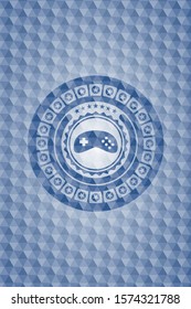 video game icon inside blue polygonal emblem.