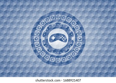 Videospielsymbol in blauem Polygonal-Emblem.