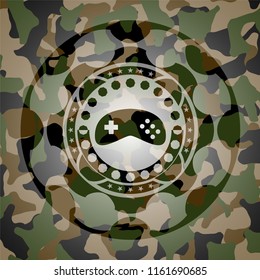 video game icon inside camouflage emblem