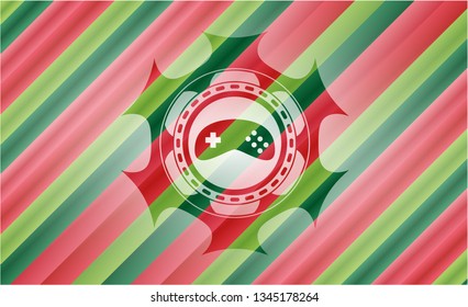 video game icon inside christmas style emblem.