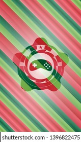 video game icon inside christmas colors emblem.