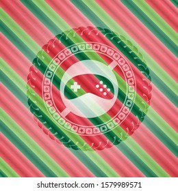 video game icon inside christmas colors style badge.