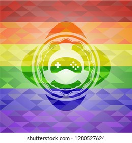 video game icon inside emblem on mosaic background with the colors of the LGBT flag