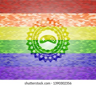 video game icon inside emblem on mosaic background with the colors of the LGBT flag