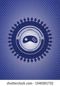 video game icon inside emblem with jean background