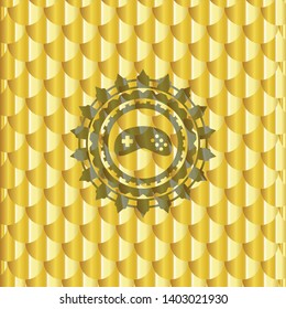 video game icon inside gold shiny badge. Scales pattern. Vector Illustration. Detailed.