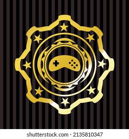 video game icon inside gold emblem. 