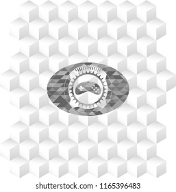 video game icon inside grey badge with geometric cube white background