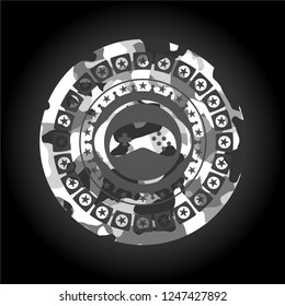 video game icon inside grey camouflage texture