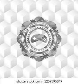 video game icon inside grey emblem with geometric cube white background