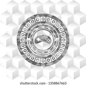 video game icon inside grey icon or emblem with geometric cube white background