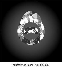 video game icon inside grey camo texture