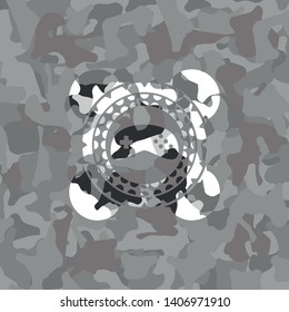 video game icon inside grey camo texture