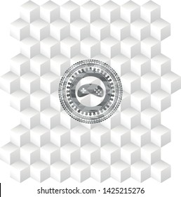 video game icon inside grey emblem with geometric cube white background