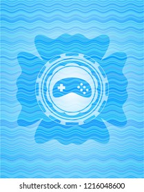 video game icon inside light blue water emblem background.