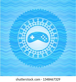 video game icon inside light blue water emblem background.