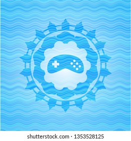 video game icon inside light blue water wave badge.