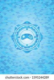 video game icon inside light blue mosaic emblem
