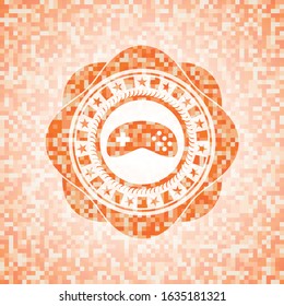 video game icon inside orange mosaic emblem