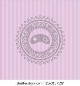 video game icon inside pink emblem