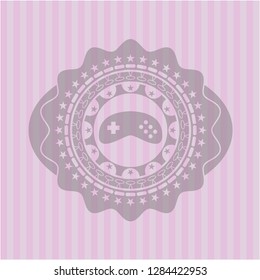 video game icon inside pink emblem