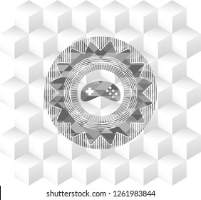 video game icon inside realistic grey emblem with geometric cube white background