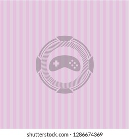 video game icon inside realistic pink emblem