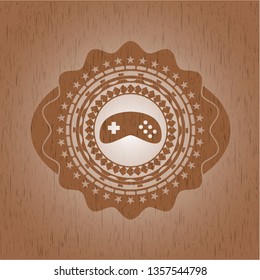 video game icon inside realistic wooden emblem