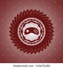 video game icon inside red emblem