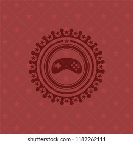 video game icon inside red emblem