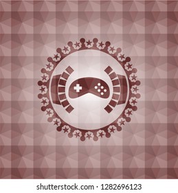 video game icon inside red seamless emblem with geometric pattern.